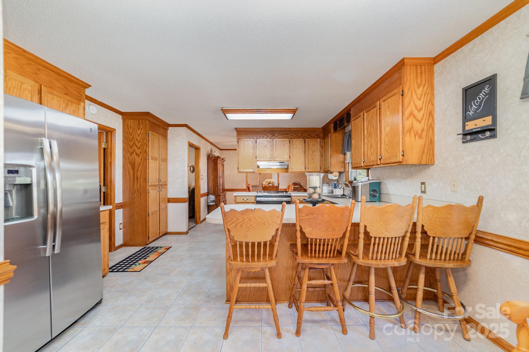 2595 Shamrock Road Harrisburg, NC 28075 - Photo 8 of 27 a dining room with furniture and a kitchen