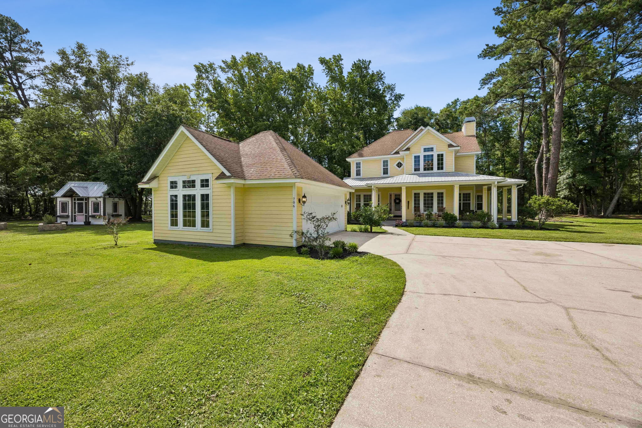 706 Hopewell Point Road White Oak, GA 31568 - Photo 53 of 84 Classic coastal Georgia charm shines through with attractive curb appeal, mature landscaping, and a welcoming wraparound porch.