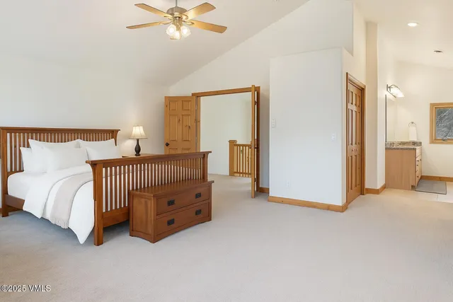 a room with a bed and a chandelier