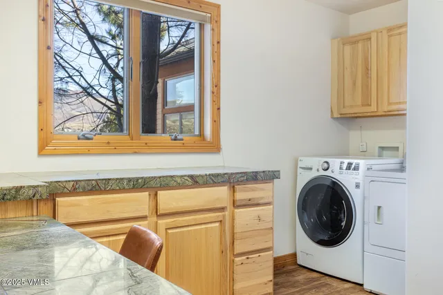 a view of a kitchen with washer and dryer