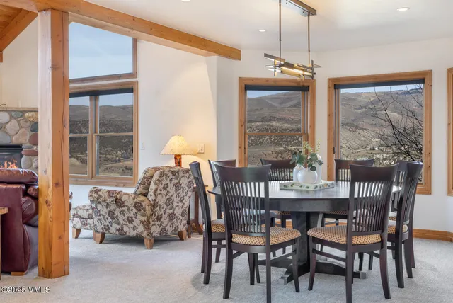 a dining room with furniture and window