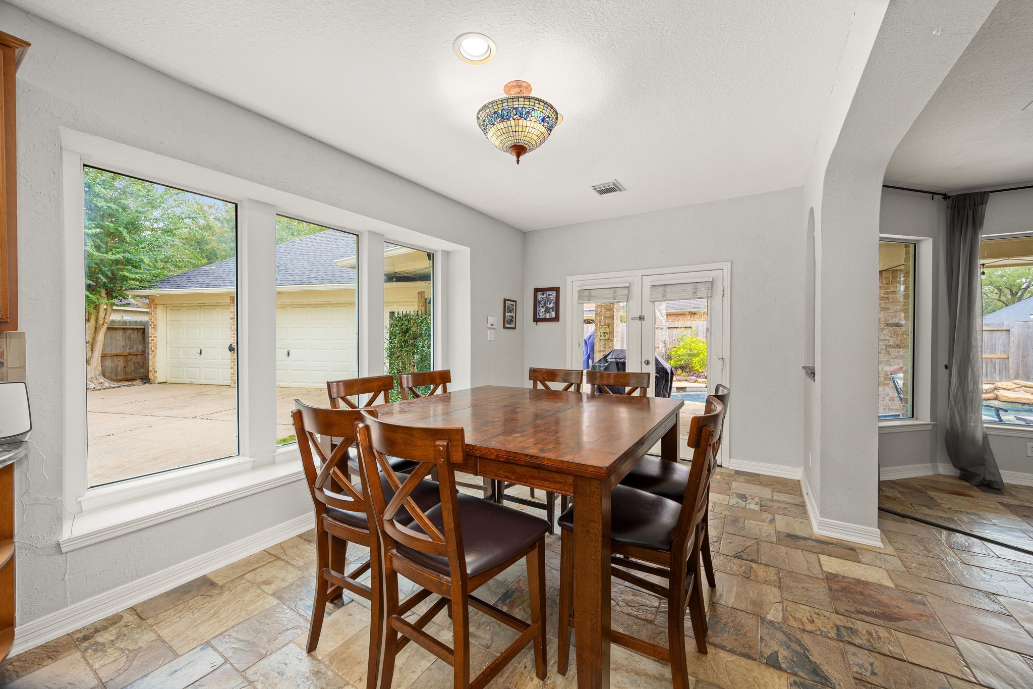 22610 Shallow Spring Court Katy, TX 77494 - Photo 11 of 45 a view of a dining room with furniture and chandelier
