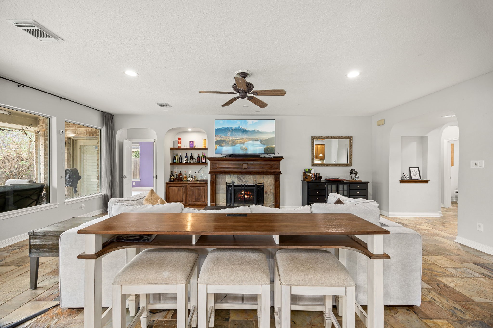 22610 Shallow Spring Court Katy, TX 77494 - Photo 12 of 45 a living room with fireplace furniture and a large window