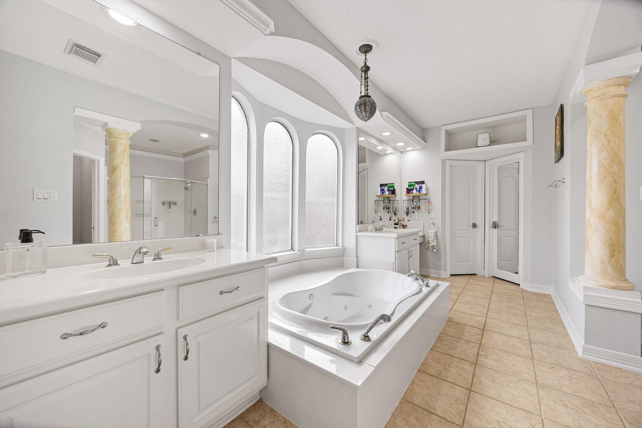 22610 Shallow Spring Court Katy, TX 77494 - Photo 18 of 45 a spacious en suite bathroom with a granite countertop sink mirror and bathtub