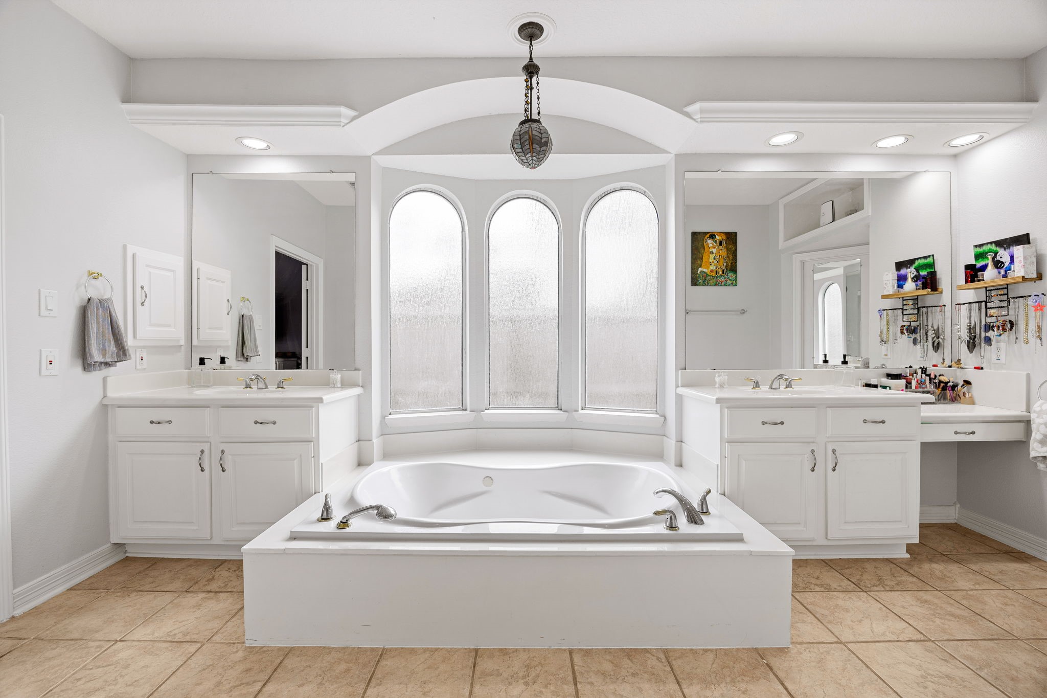 22610 Shallow Spring Court Katy, TX 77494 - Photo 19 of 45 a spacious en suite bathroom with a granite countertop tub a double vanity sink a window and a mirror