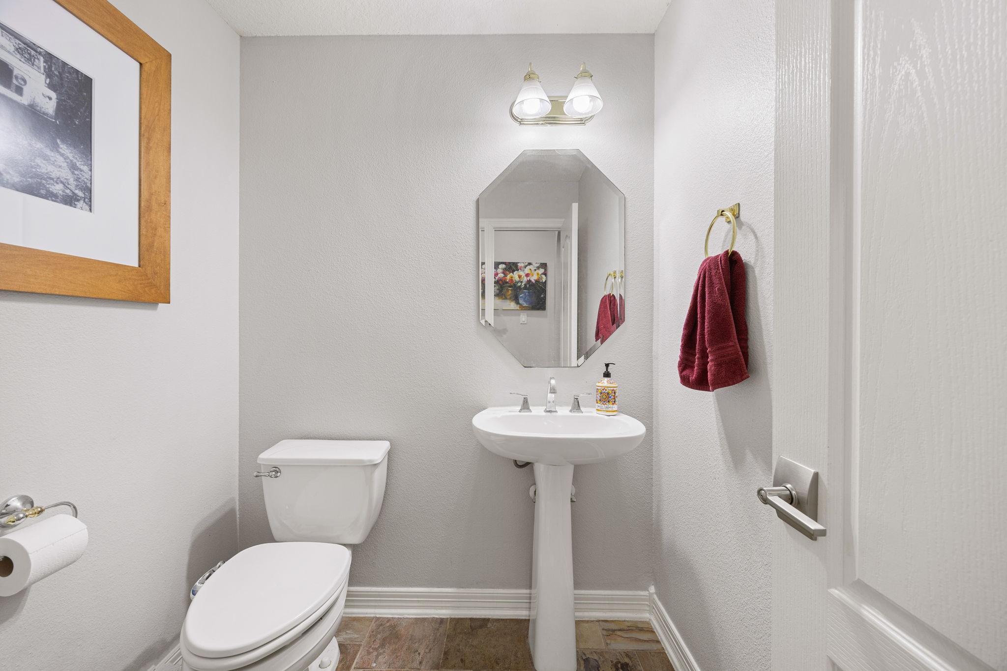 22610 Shallow Spring Court Katy, TX 77494 - Photo 22 of 45 a bathroom with a toilet sink and mirror