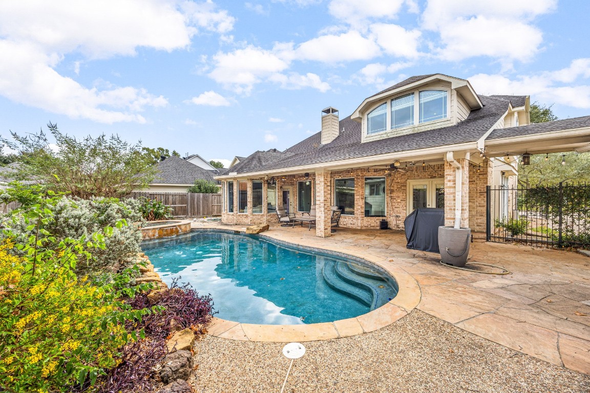 22610 Shallow Spring Court Katy, TX 77494 - Photo 24 of 45 a front view of a house with swimming pool having outdoor seating