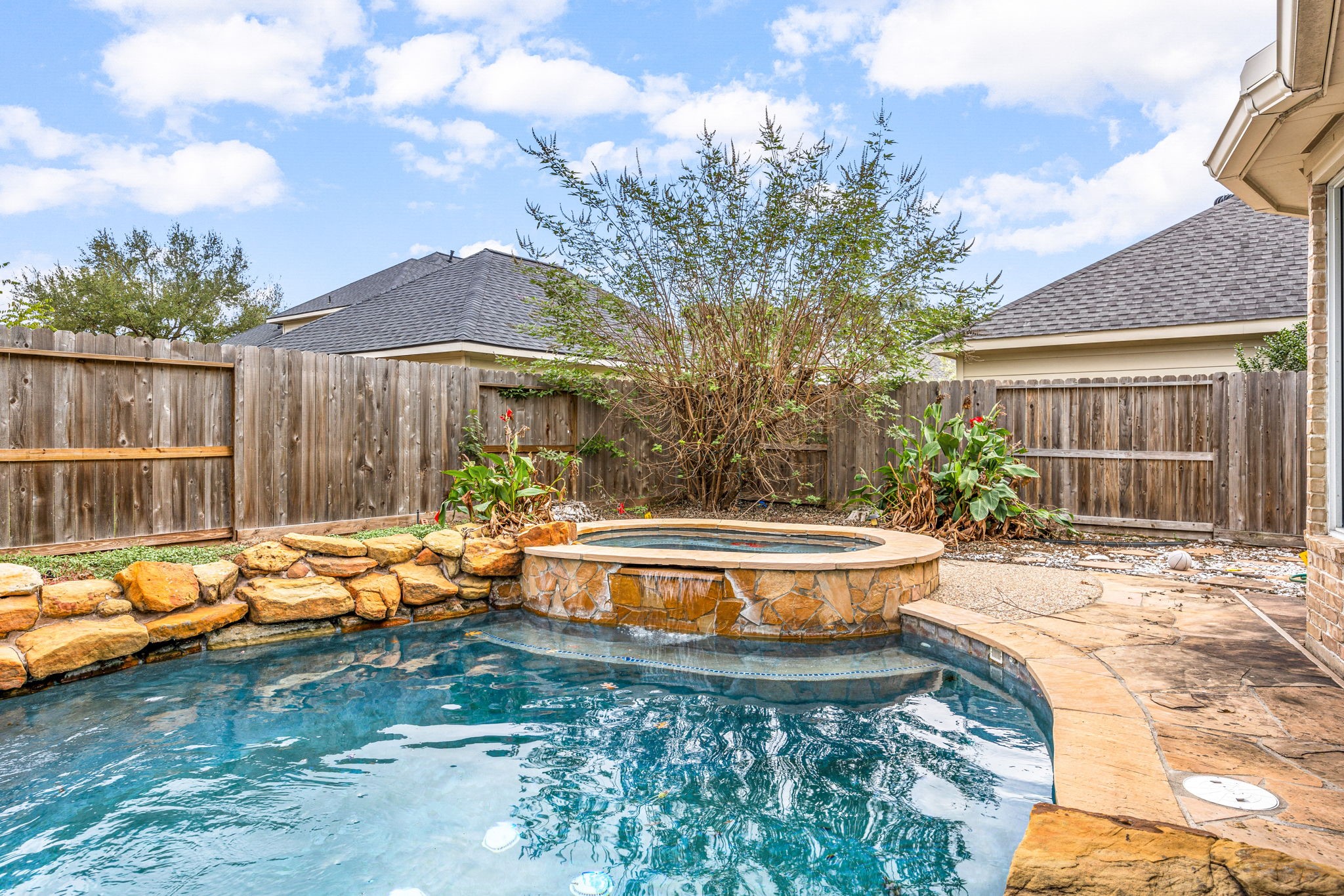 22610 Shallow Spring Court Katy, TX 77494 - Photo 26 of 45 a front view of a house with swimming pool and sitting area