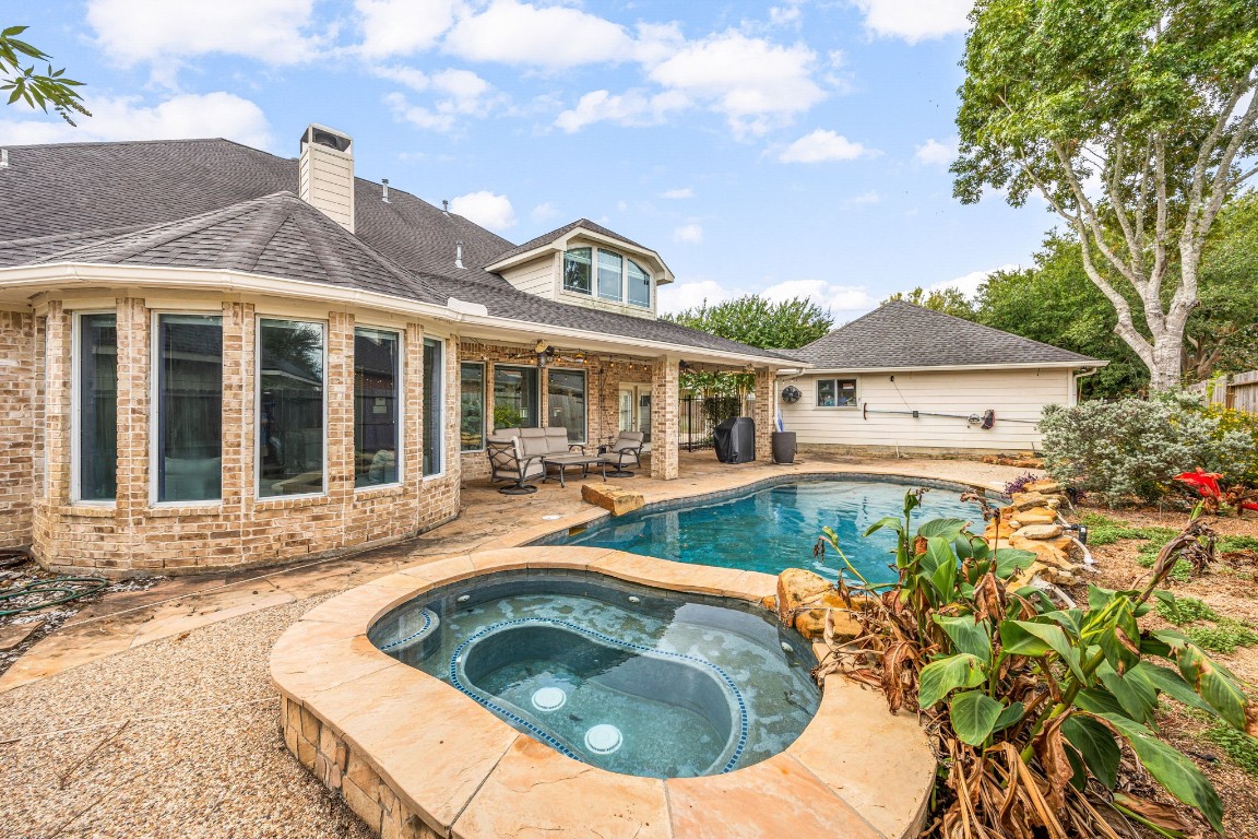 22610 Shallow Spring Court Katy, TX 77494 - Photo 27 of 45 a view of a house with swimming pool and sitting area