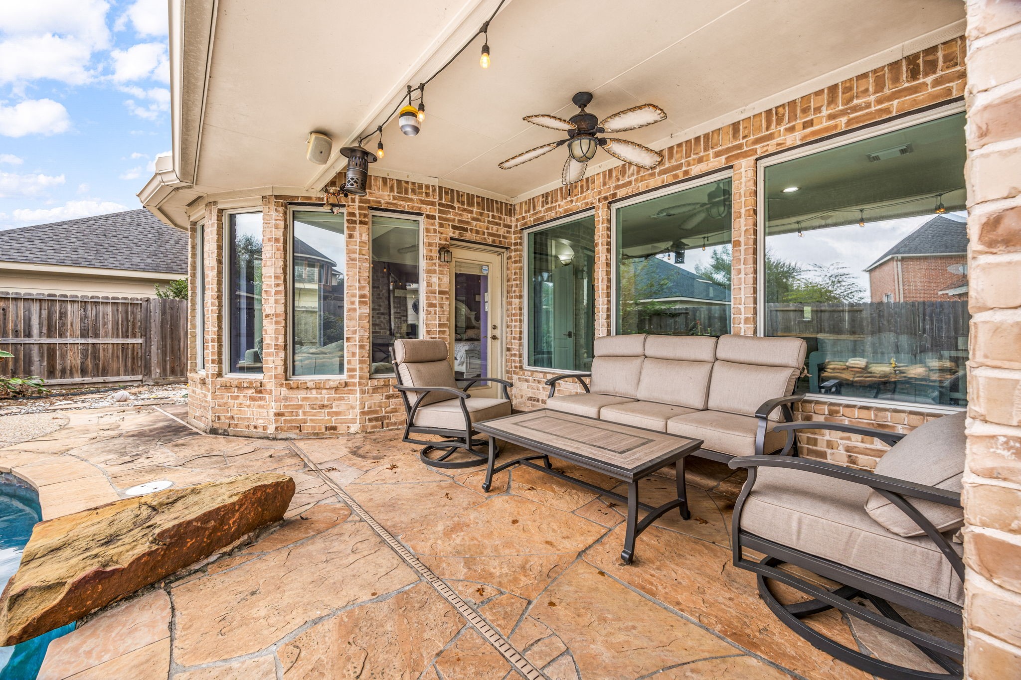 22610 Shallow Spring Court Katy, TX 77494 - Photo 28 of 45 a outdoor space with patio the couches and a dining table with the view of the balcony