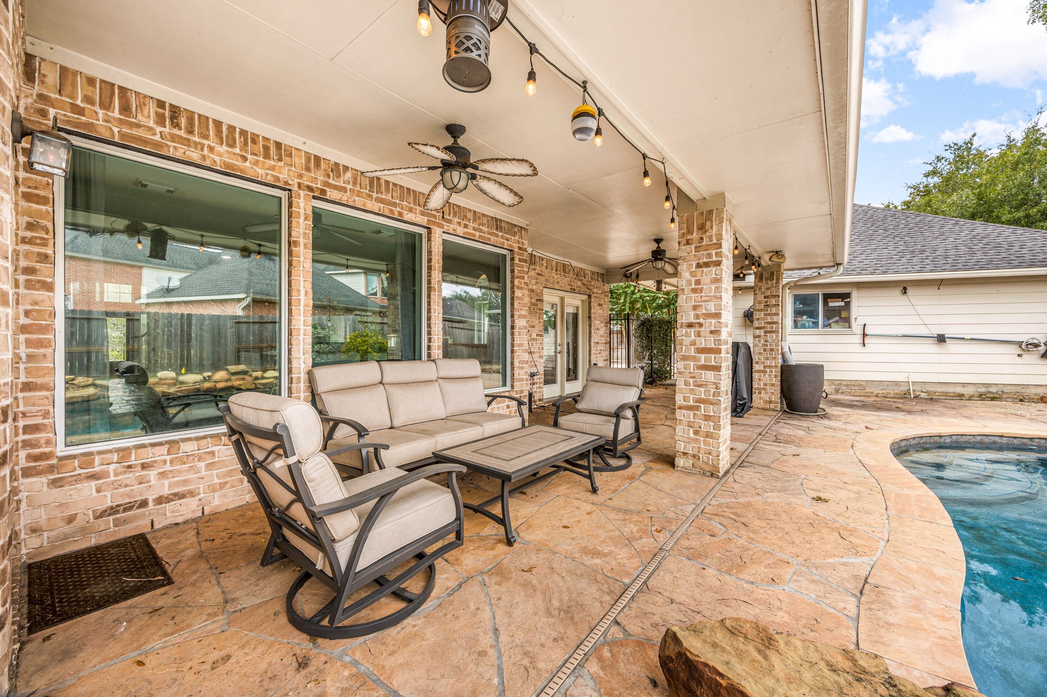 22610 Shallow Spring Court Katy, TX 77494 - Photo 29 of 45 a view of a swimming pool with a patio
