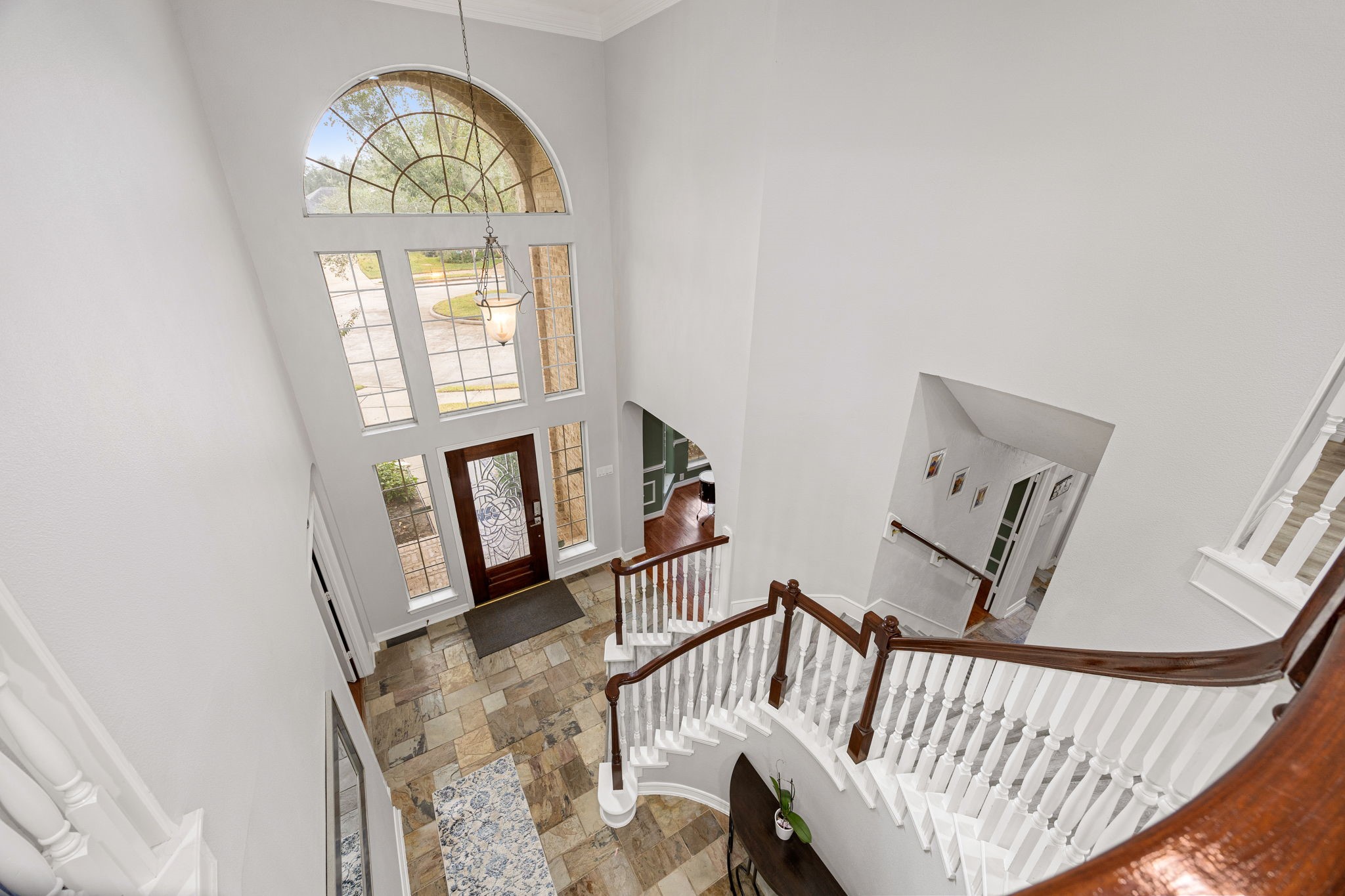 22610 Shallow Spring Court Katy, TX 77494 - Photo 30 of 45 a view of staircase with railing and a large window