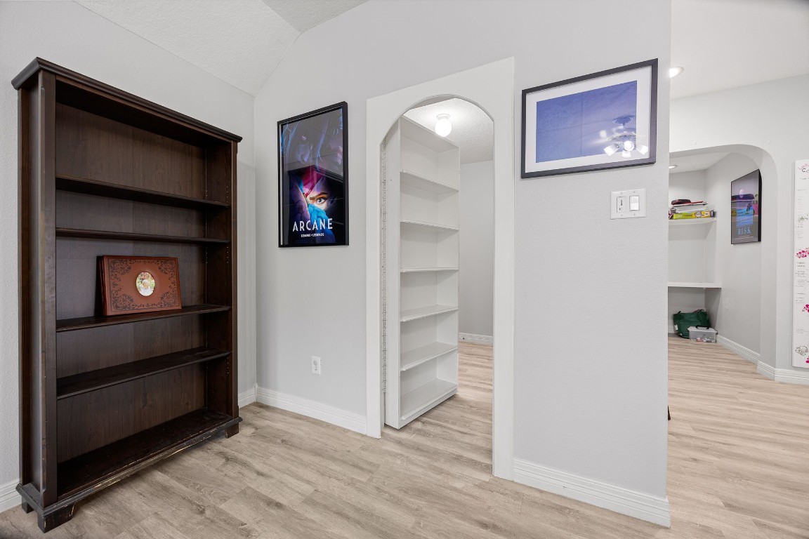 22610 Shallow Spring Court Katy, TX 77494 - Photo 33 of 45 a view of a hallway with wooden floor and closet