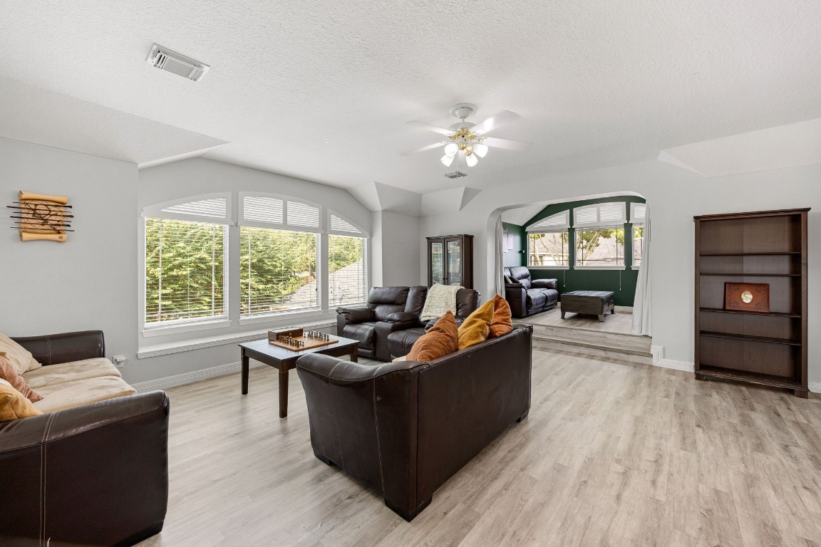 22610 Shallow Spring Court Katy, TX 77494 - Photo 35 of 45 a living room with furniture fireplace and a large window