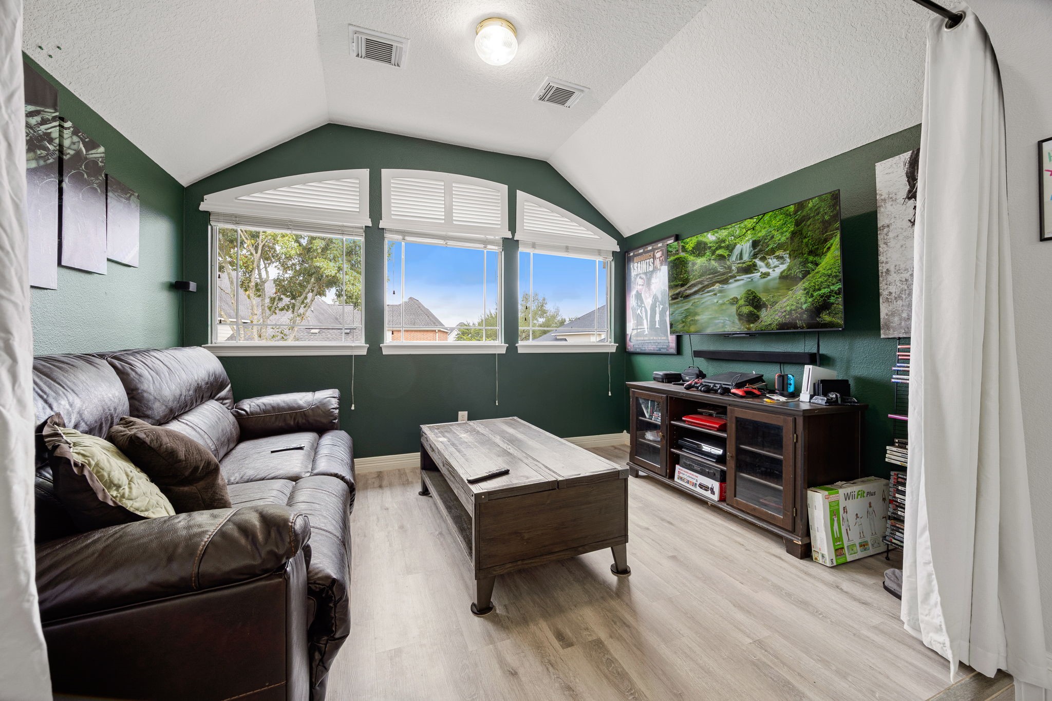 22610 Shallow Spring Court Katy, TX 77494 - Photo 37 of 45 a living room with furniture a large window and a flat screen tv