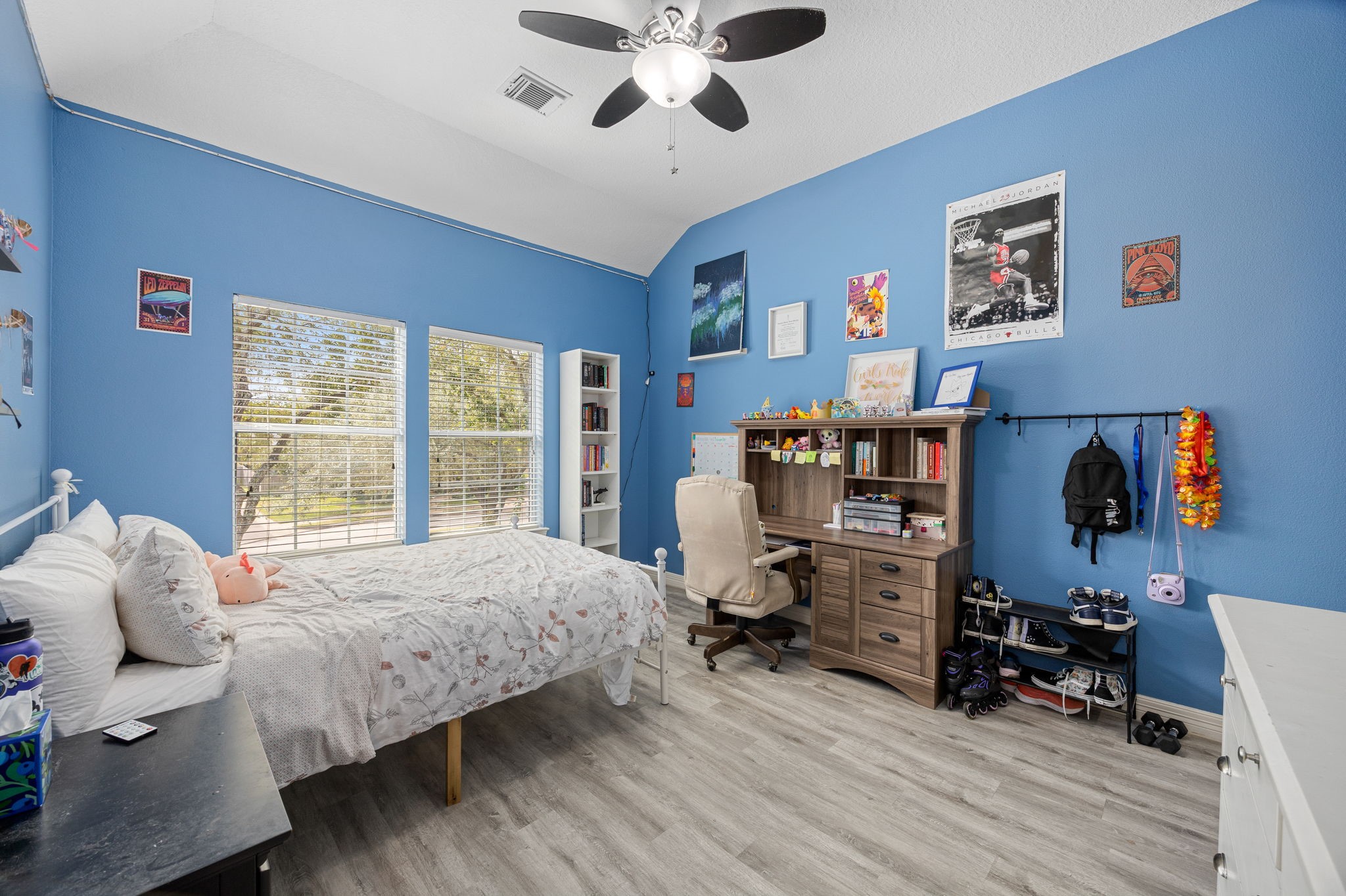 22610 Shallow Spring Court Katy, TX 77494 - Photo 40 of 45 a bedroom with bed a large window and a chandelier