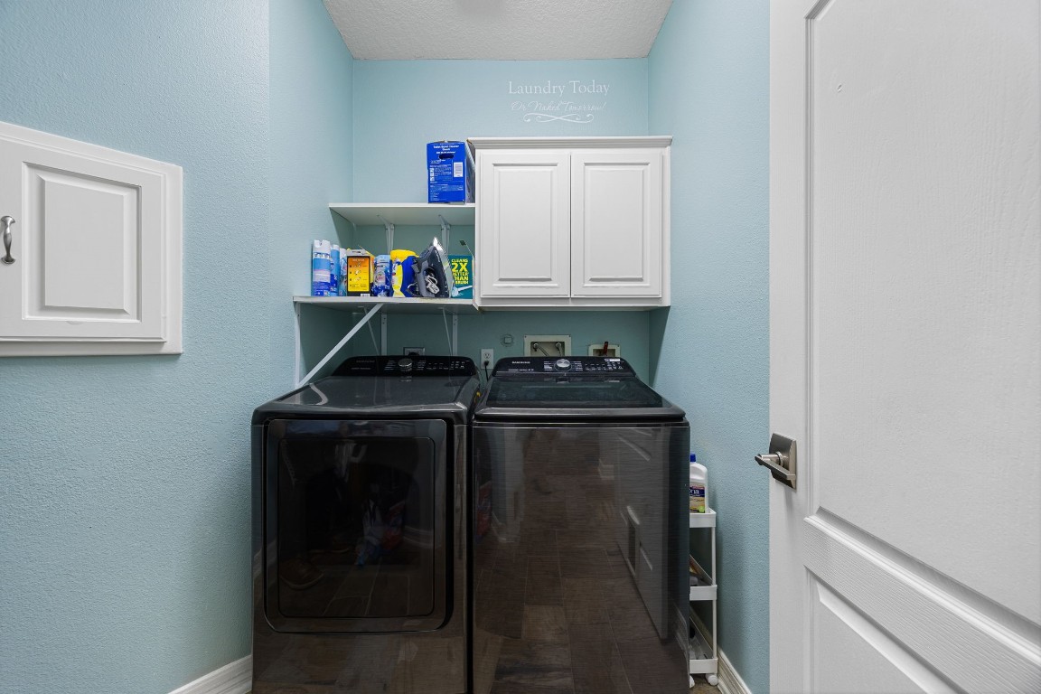22610 Shallow Spring Court Katy, TX 77494 - Photo 43 of 45 a utility room with dryer and washer