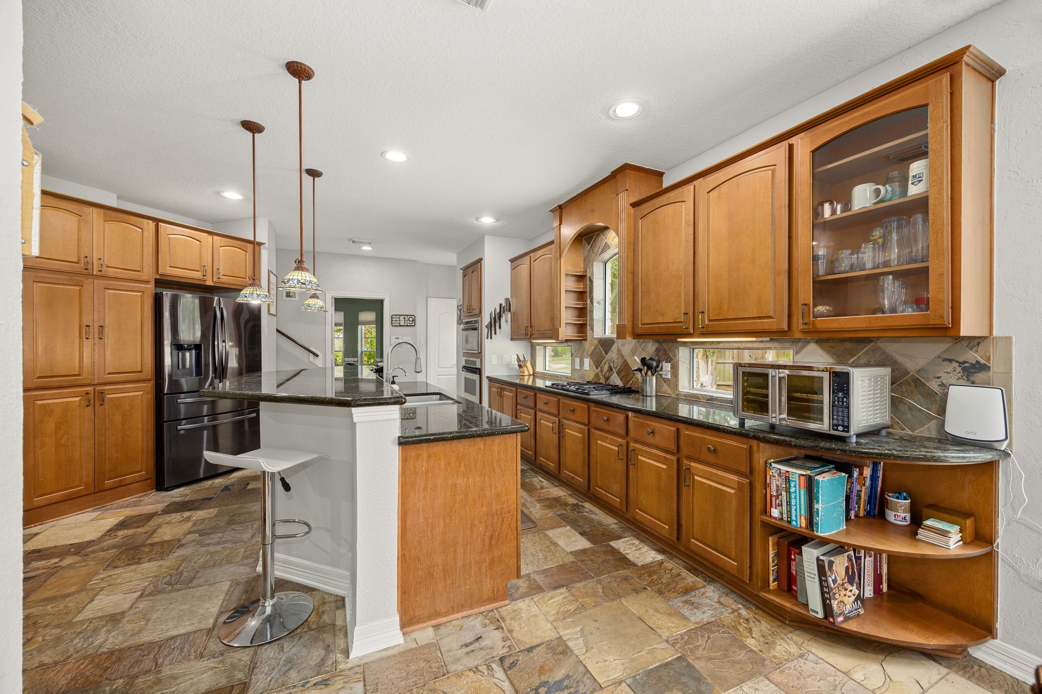 22610 Shallow Spring Court Katy, TX 77494 - Photo 5 of 45 a kitchen with stainless steel appliances granite countertop a refrigerator a oven a sink a stove and a refrigerator