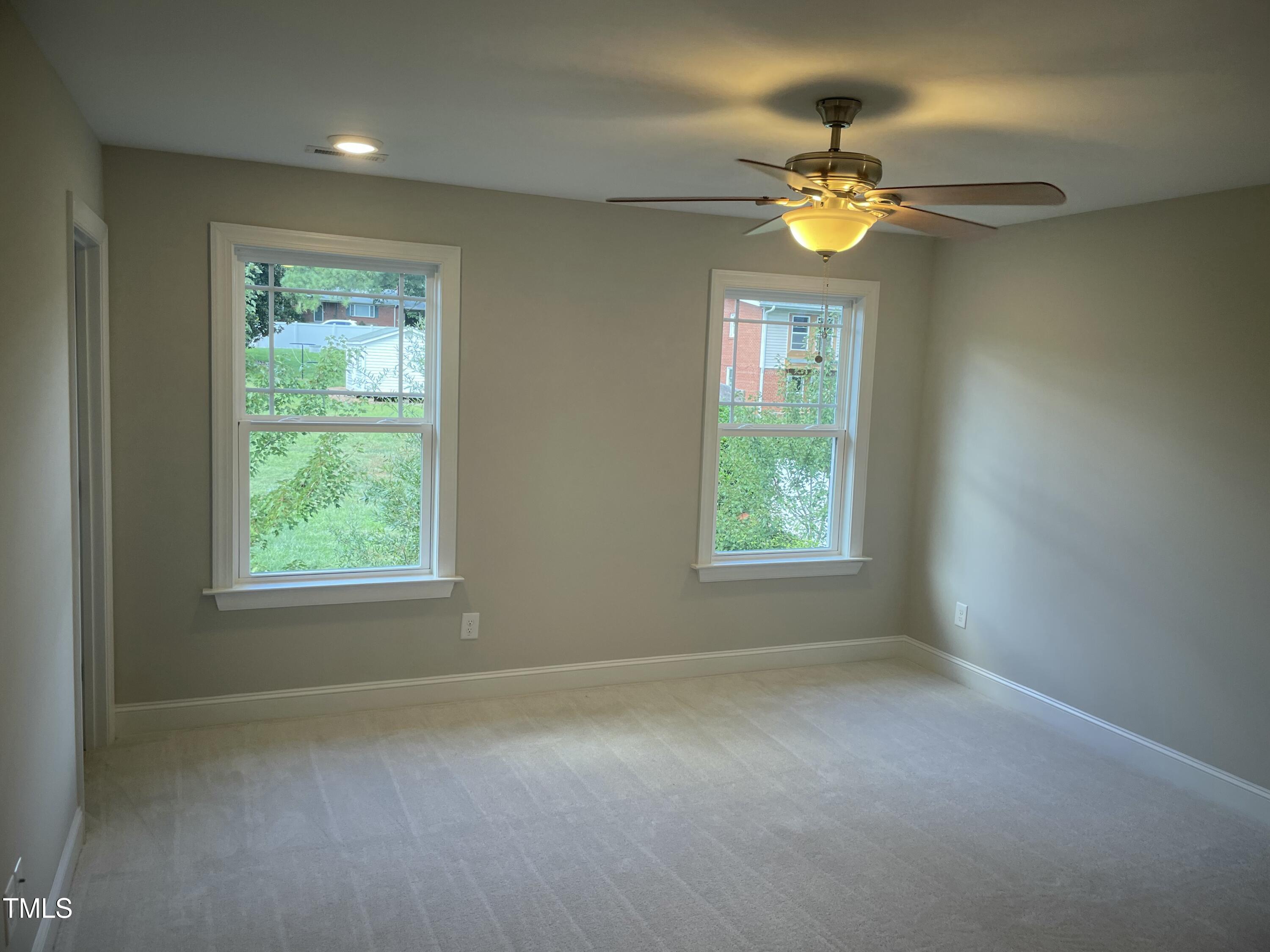 5502 Batoul Lane Raleigh, NC 27606 - Photo 17 of 35 a view of an empty room with a window