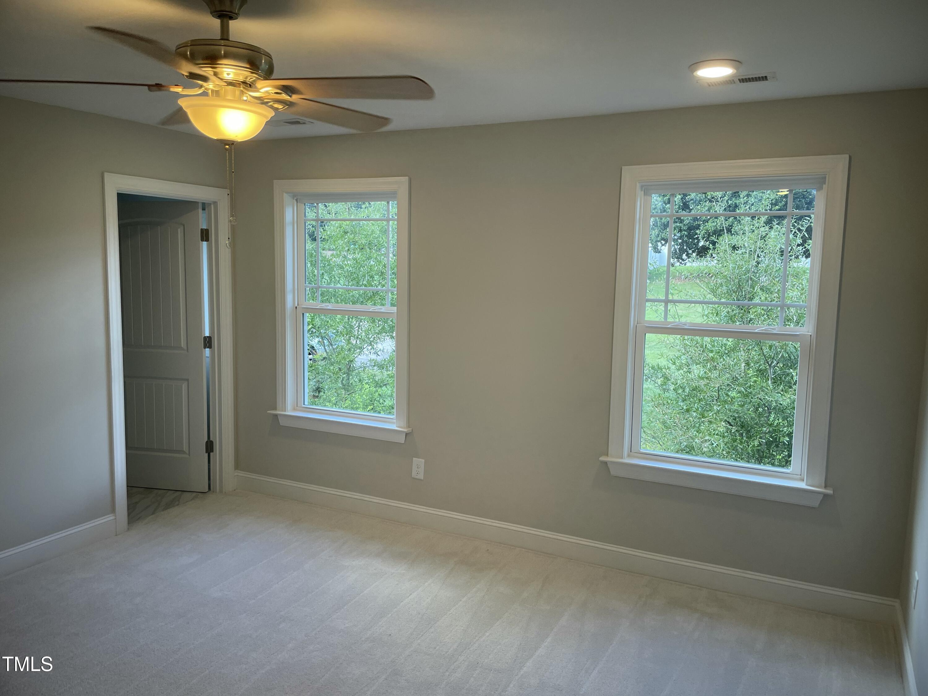 5502 Batoul Lane Raleigh, NC 27606 - Photo 18 of 35 a view of an empty room with a window