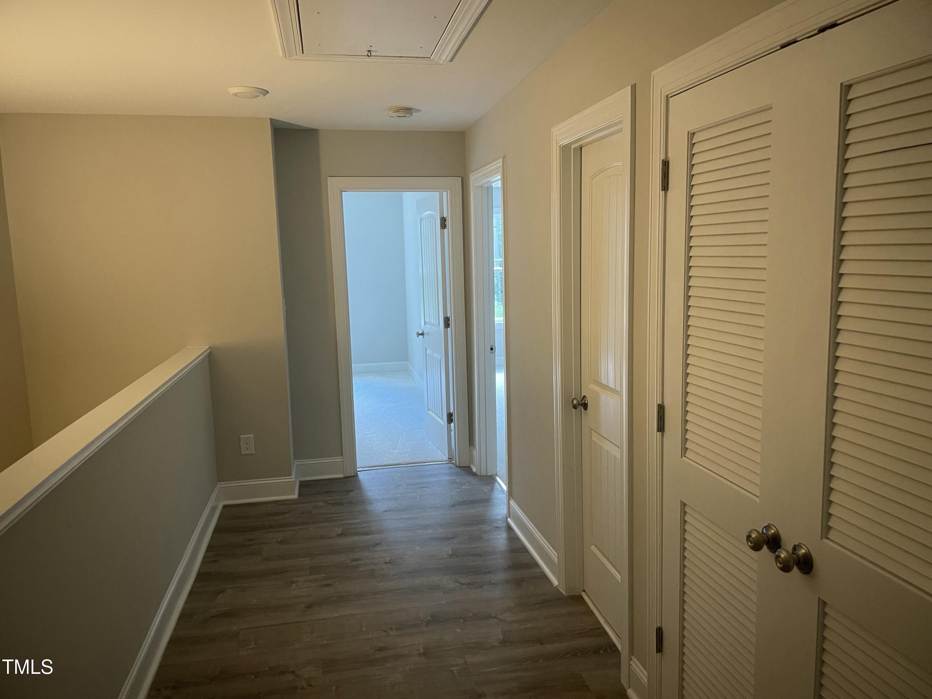 5502 Batoul Lane Raleigh, NC 27606 - Photo 26 of 35 a view of a hallway with wooden floor