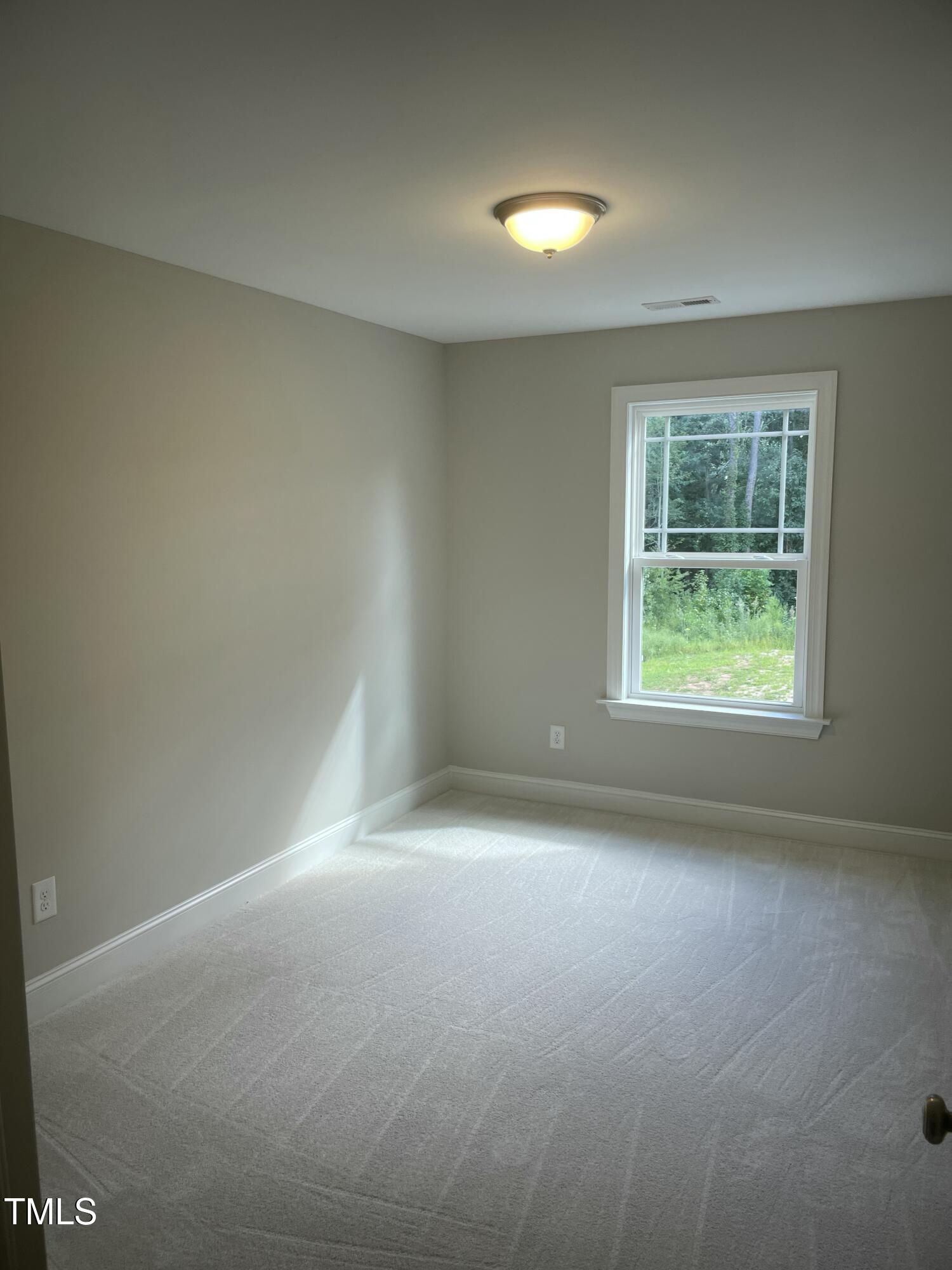 5502 Batoul Lane Raleigh, NC 27606 - Photo 31 of 35 an empty room with windows
