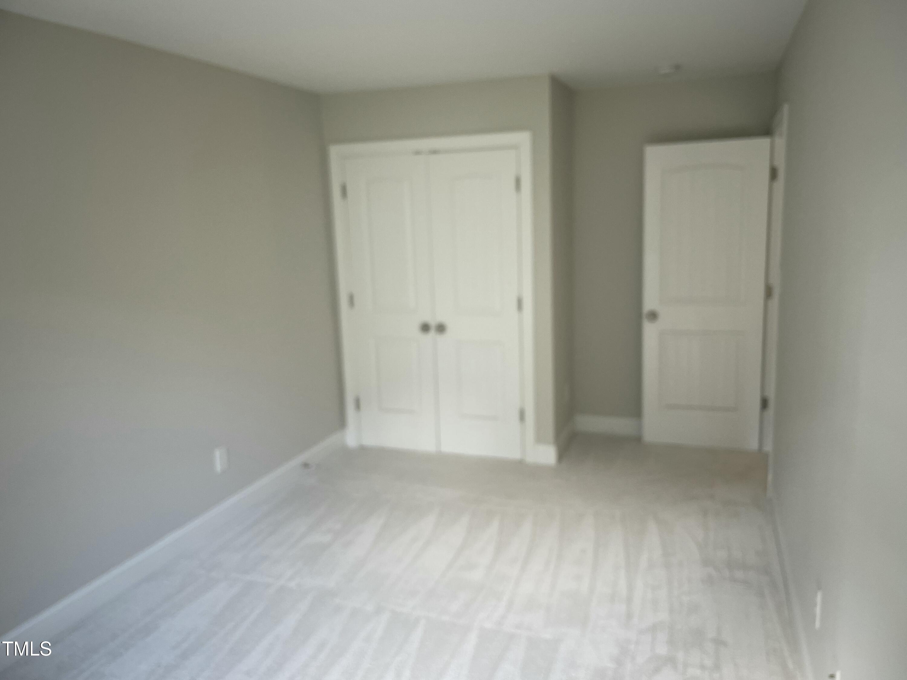 5502 Batoul Lane Raleigh, NC 27606 - Photo 32 of 35 a view of an empty room and closet area