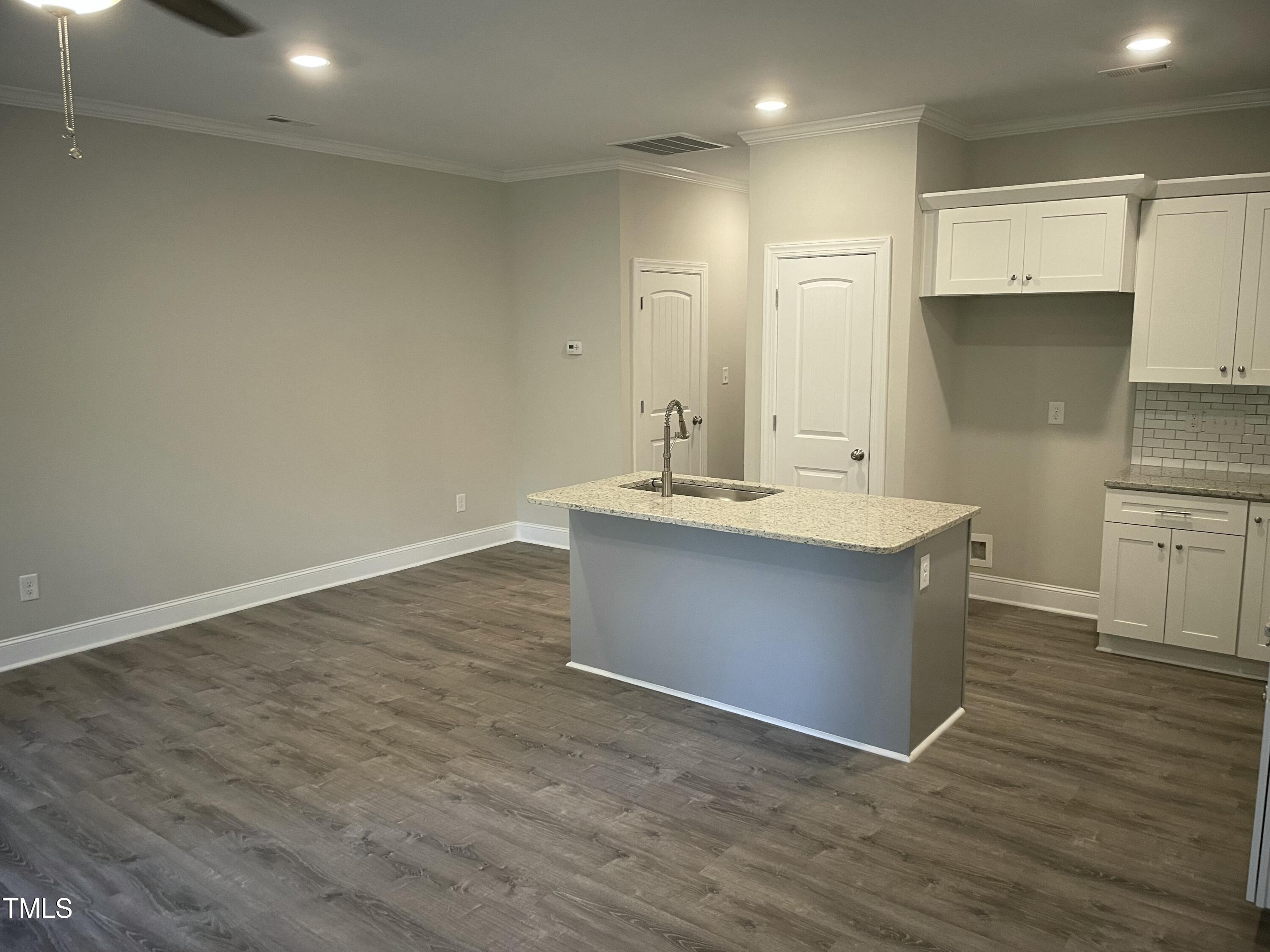5502 Batoul Lane Raleigh, NC 27606 - Photo 8 of 35 a bathroom with a sink and a mirror