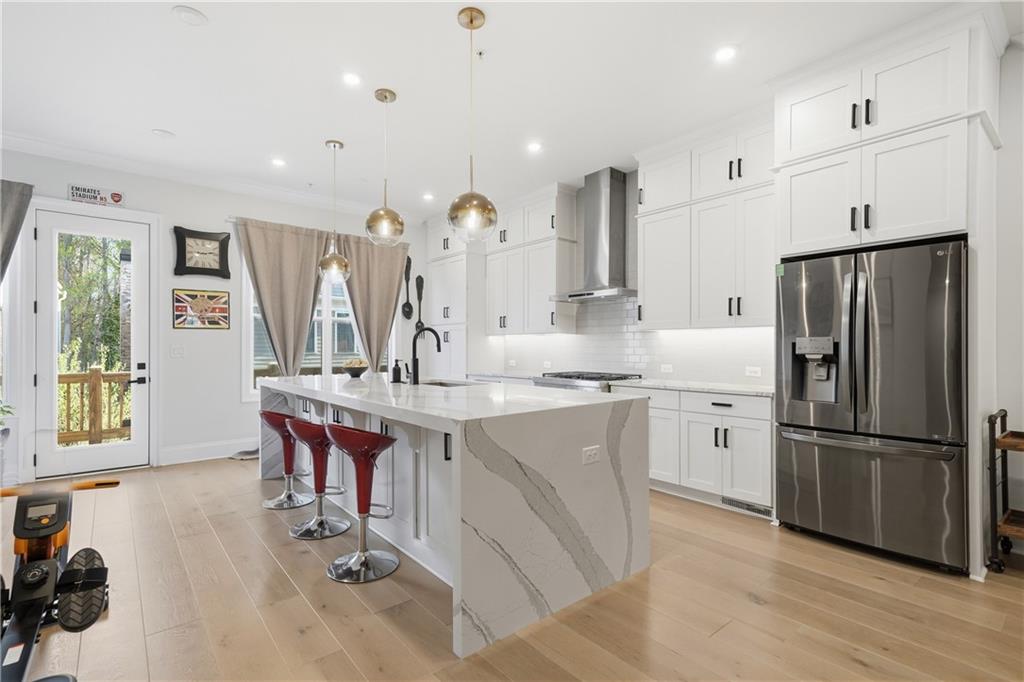 320 Concord Street Alpharetta, GA 30009 - Photo 13 of 48 a kitchen with counter top space and appliances