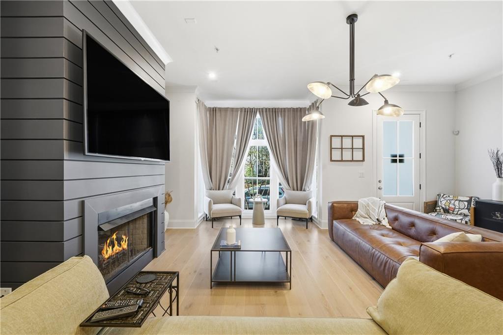 320 Concord Street Alpharetta, GA 30009 - Photo 2 of 48 a living room with furniture a fireplace and a flat screen tv
