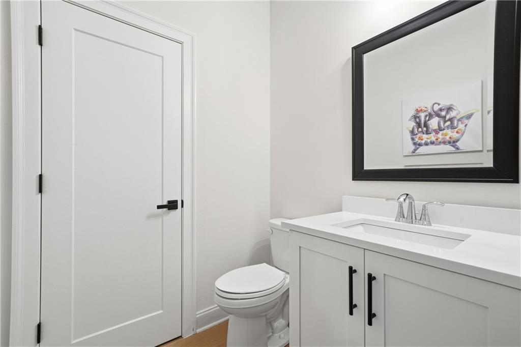 320 Concord Street Alpharetta, GA 30009 - Photo 25 of 48 a bathroom with a sink toilet and vanity
