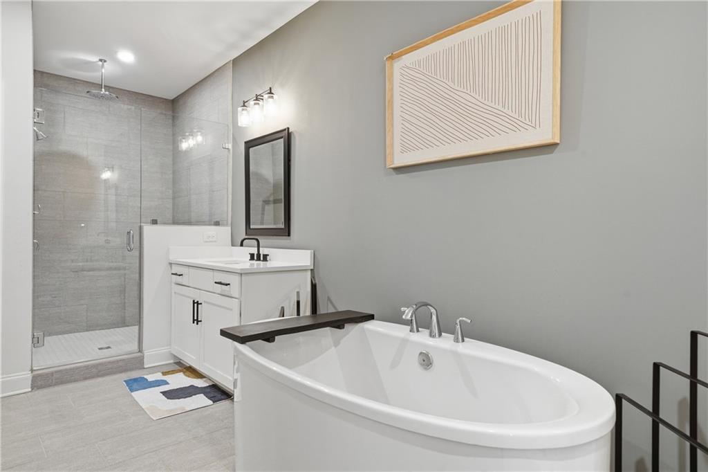 320 Concord Street Alpharetta, GA 30009 - Photo 31 of 48 a bathroom with a sink a toilet and shower