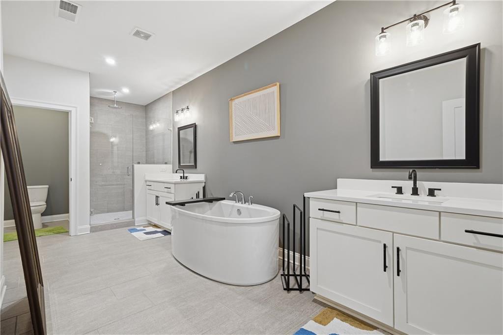 320 Concord Street Alpharetta, GA 30009 - Photo 32 of 48 a bathroom with a toilet sink and mirror
