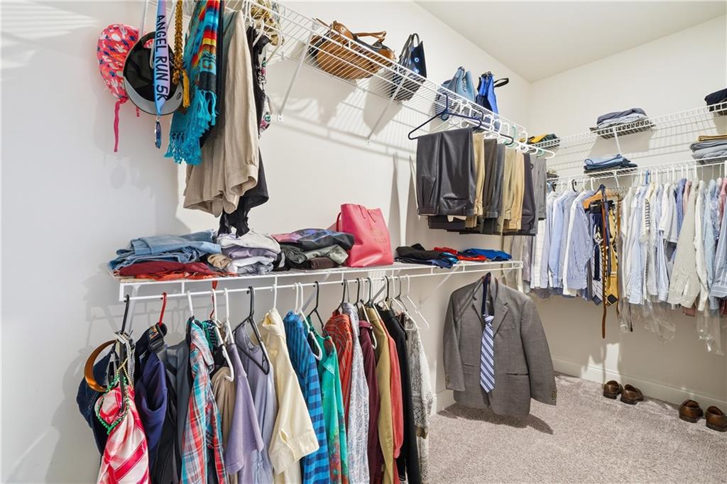 320 Concord Street Alpharetta, GA 30009 - Photo 33 of 48 a view of walk in closet with clothes