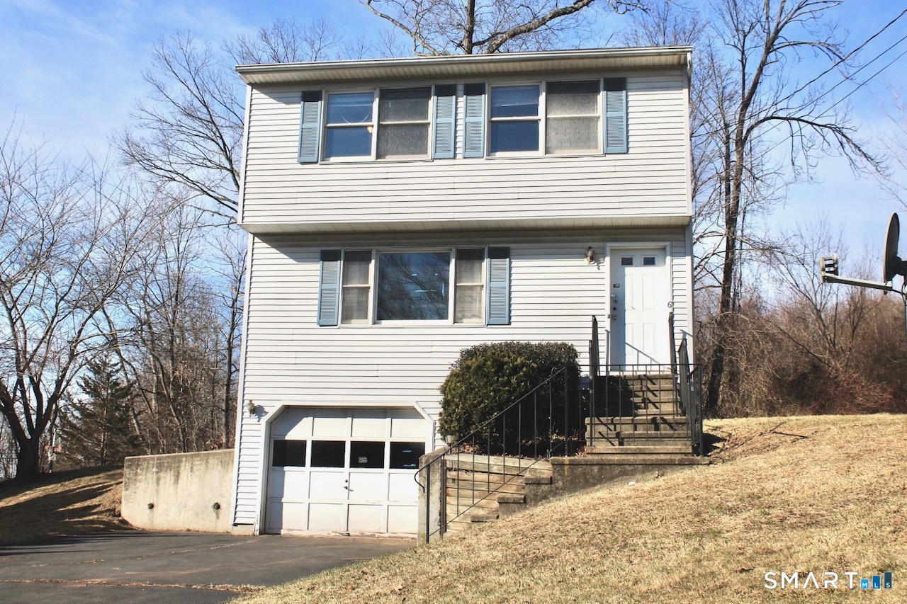 6 North Lane Wallingford, CT 06492 - Photo 1 of 34 a front view of a house with a yard