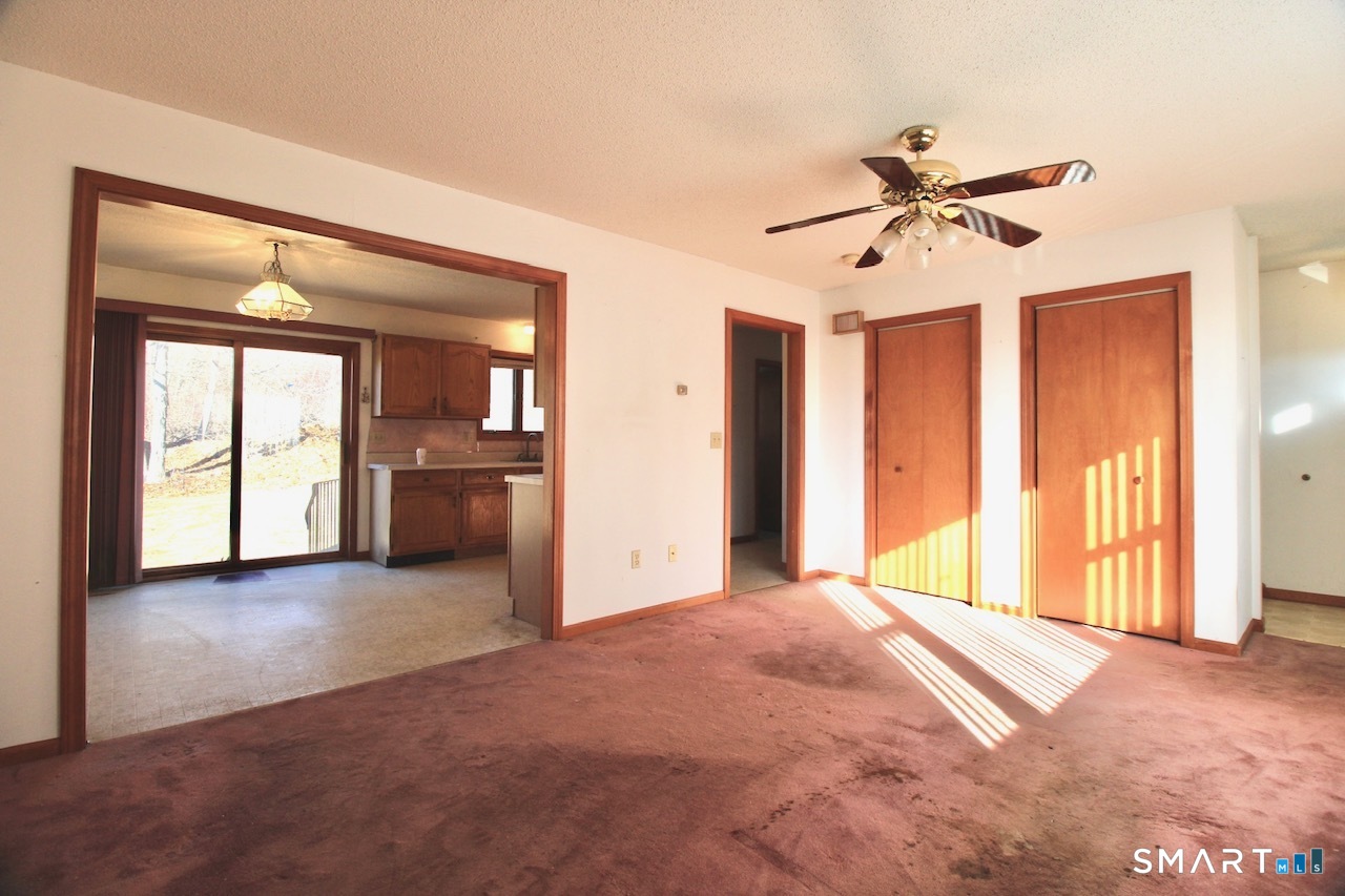 6 North Lane Wallingford, CT 06492 - Photo 13 of 34 a view of a big room with windows and cabinet