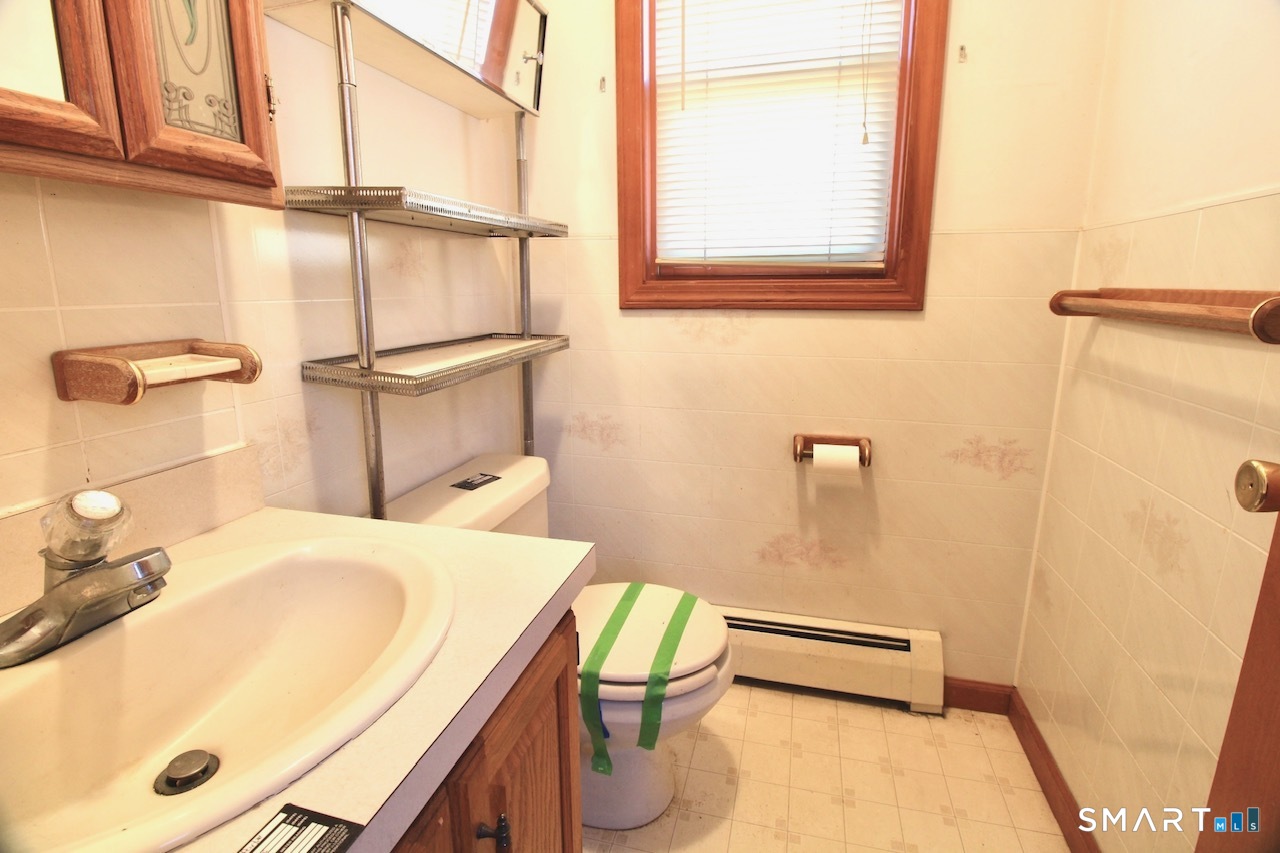 6 North Lane Wallingford, CT 06492 - Photo 19 of 34 a bathroom with a sink and a mirror