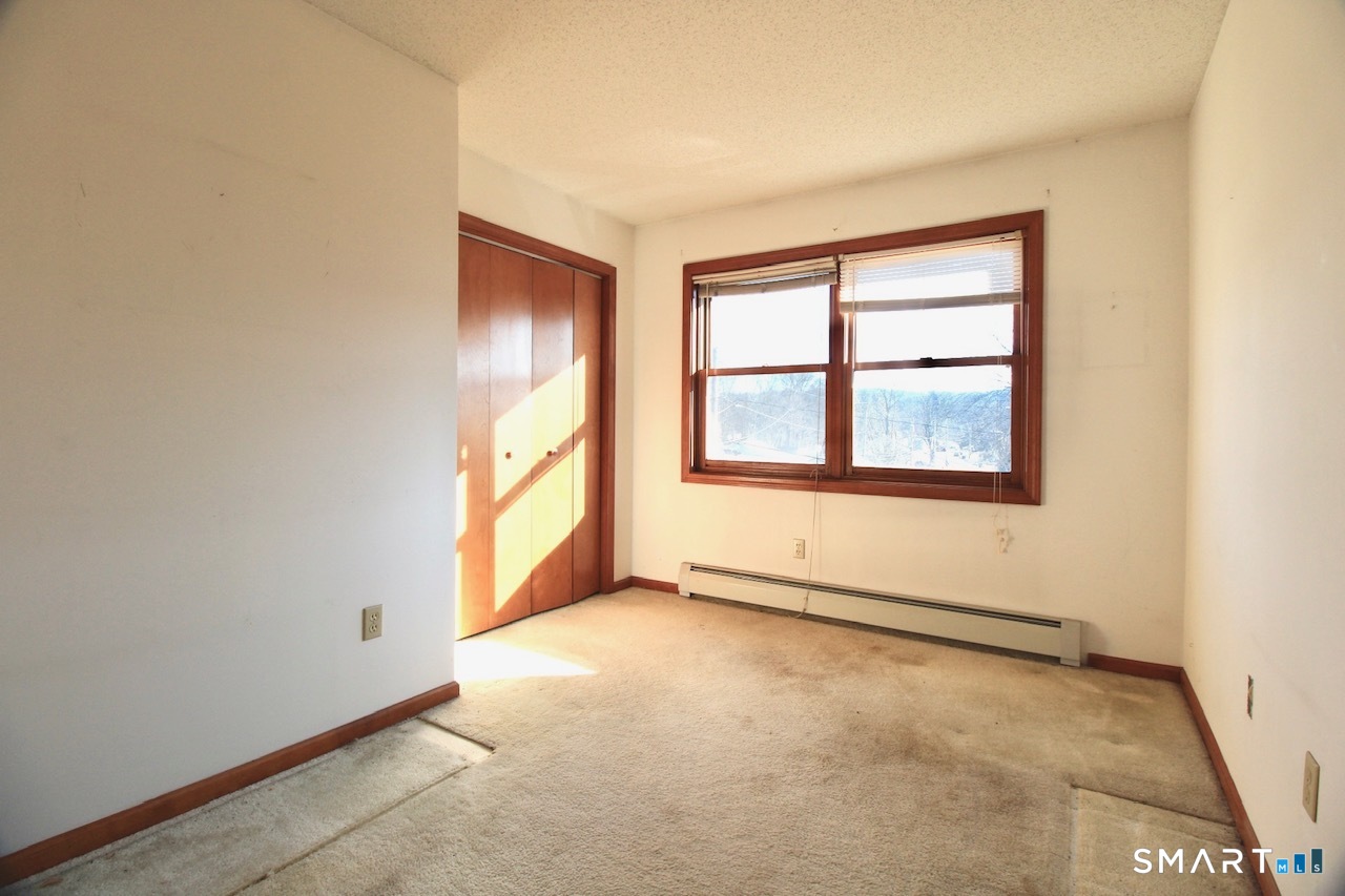 6 North Lane Wallingford, CT 06492 - Photo 26 of 34 an empty room with windows