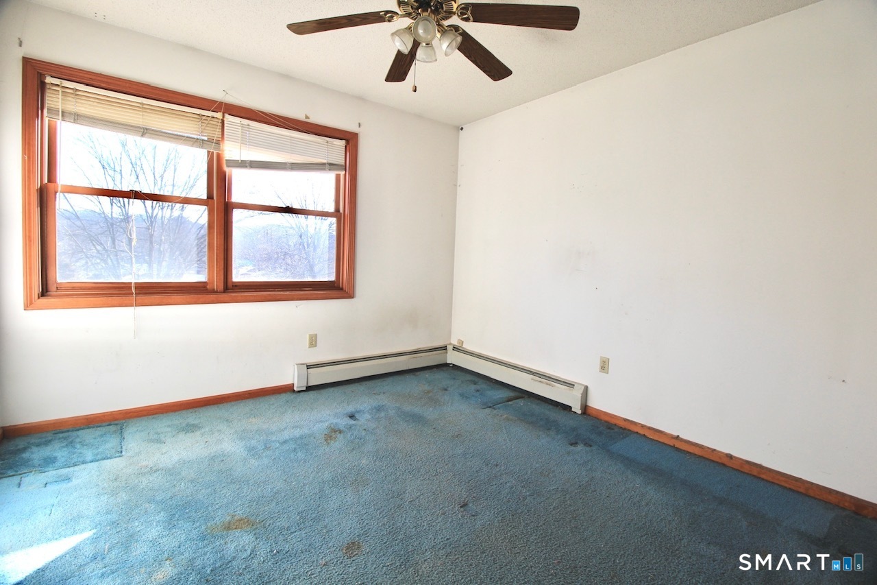6 North Lane Wallingford, CT 06492 - Photo 30 of 34 an empty room with a window and a ceiling fan