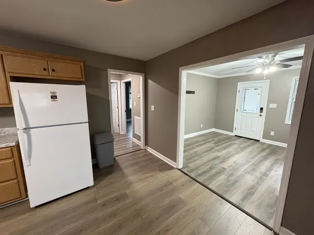 a view of a storage & utility room with wooden floor