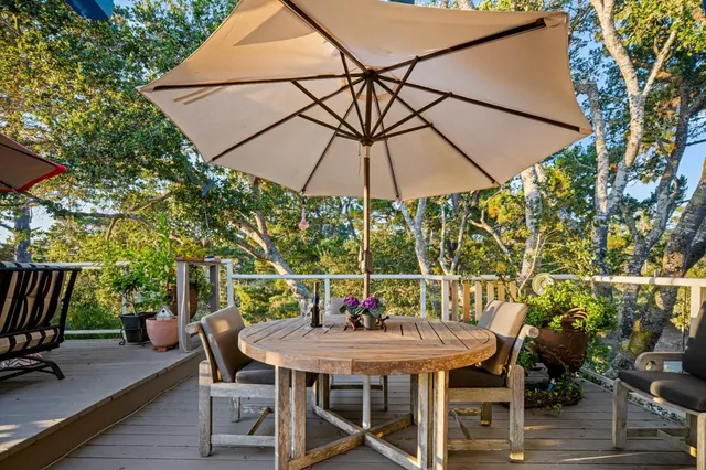 a wooden bench sitting in front of a building