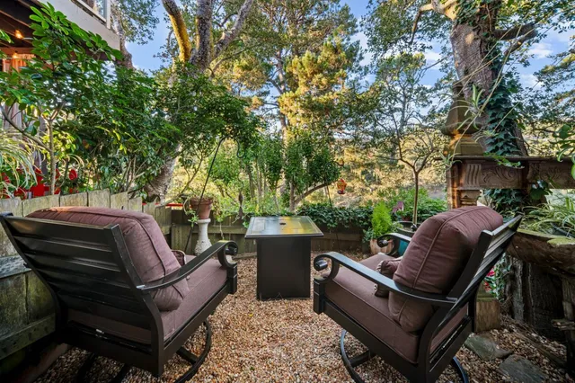 a room with furniture a flat screen tv and a window