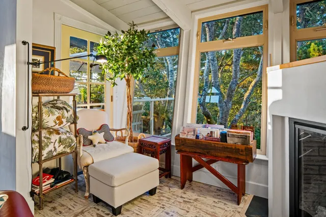 a balcony with furniture and umbrella