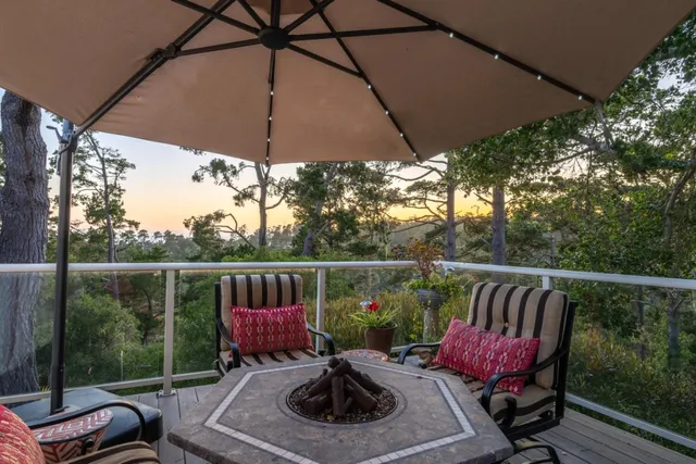 a bedroom with a bed and dresser with mirror