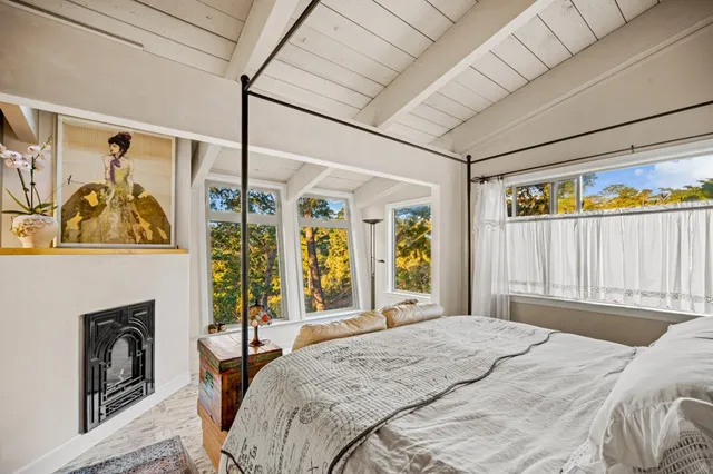 a bedroom with a bed and a walk in closet