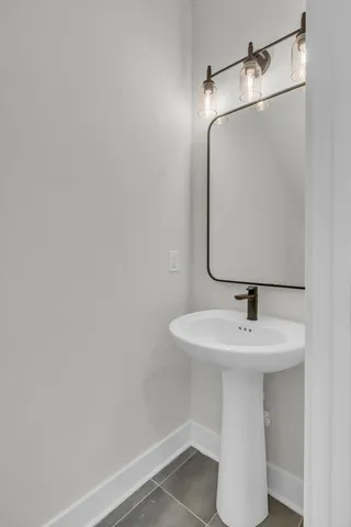 a bathroom with a sink and mirror