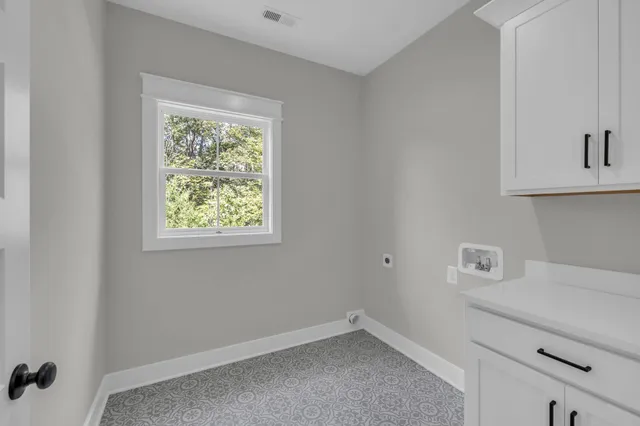 a room with a window and a ceiling fan