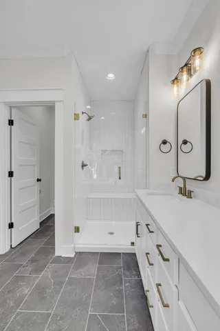 a bathroom with a sink tub and a mirror