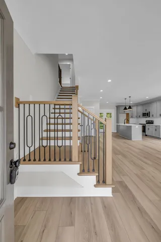 a view of entryway with wooden floor