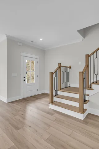 a view of entryway with wooden floor